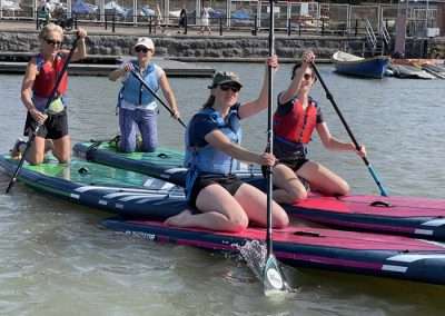 Hen group kayaking and paddleboarding on Bristol Harbour during a hen party in Bristol